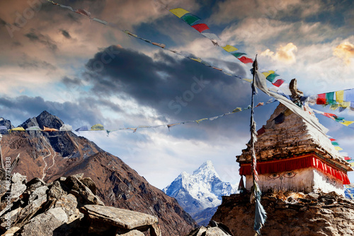 Prayer flags are blowing in the wind on the Ama Dablam in Nepal