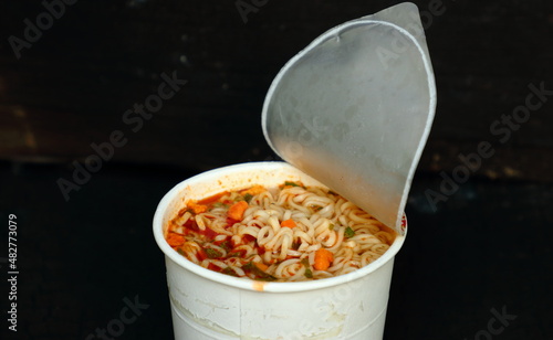 Instant noodles in white cups, unbranded. on Dark background