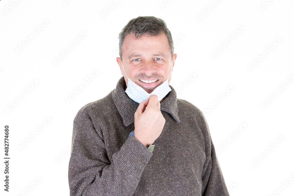 man takes off surgical mask protective face mask Covid virus defeated COVID-19 man takes off surgical mask protective face mask Covid virus defeated COVID-19