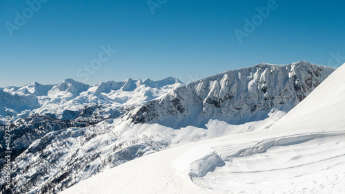 View from the ski slope to the surrounding hills on Vogel, Slovenia © jakazvan