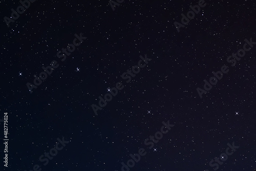 Blue night sky with many stars background. © Adil