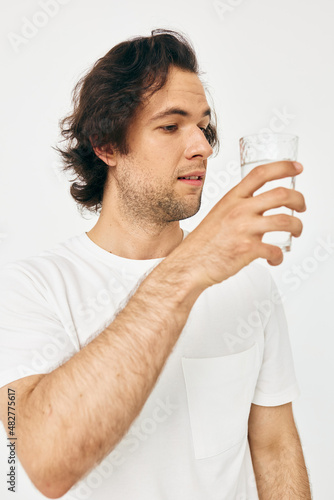 man in a white T-shirt glass of water Lifestyle unaltered