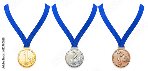 Set gold, silver and bronze medal on blue ribbon. Winter sport game award