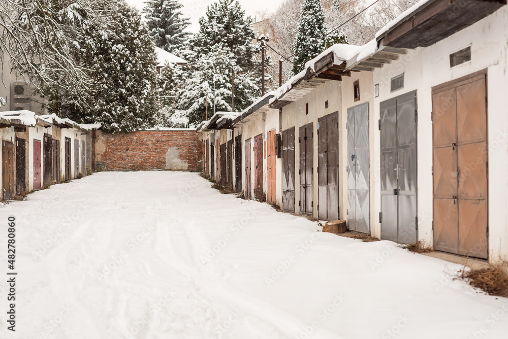 Residential garages in the town. Old facade.