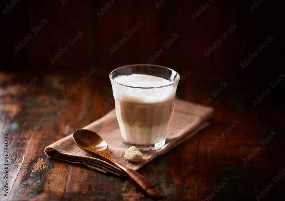 Coffee with milk on wooden background. Soft focus. Copy space. Coffee with milk on wooden background. Soft focus. Copy space.