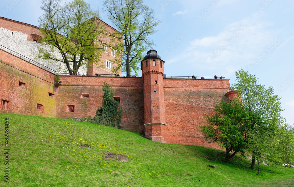 KRAKOW, MALOPOLSKIE POLAND - 30 April 2017: Tourists visit Wawel Royal Castle. View of the castle walls