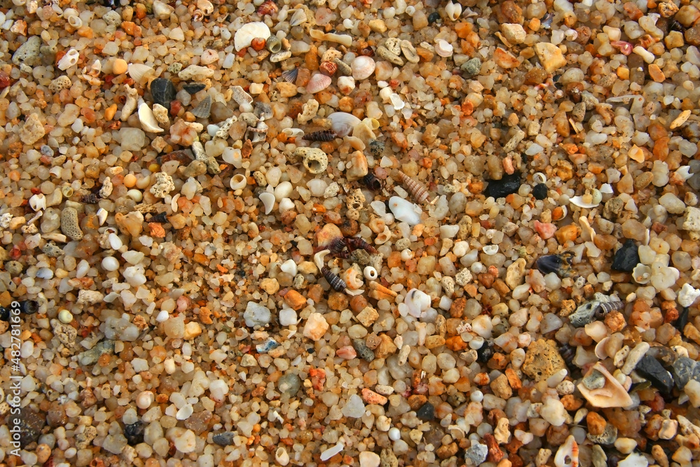 Close up of stones and marble. Smooth and polished. Pebble on shingle beach. Colorful small pebble and stone texture. Pebble background. Gravel pebble or rock fragments, beach sand