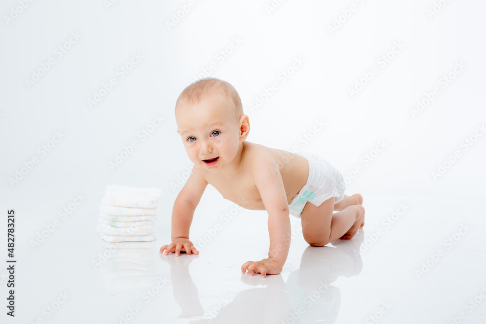 baby boy in a diaper crawling on a white background isolated baby boy in a diaper crawling on a white background isolated