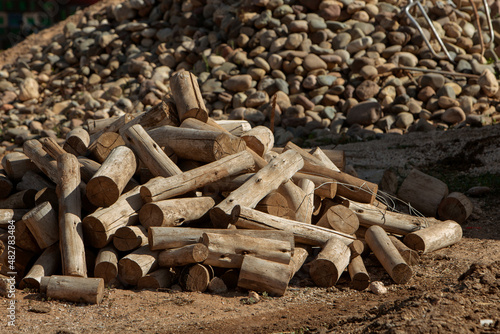 photo of firewood piled on the ground