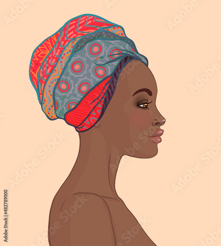 Portrait of beautiful African woman in turban (profile view)