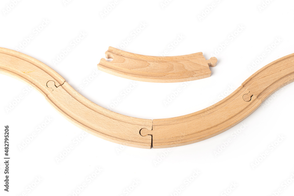 Wooden toy railroad track. Conceptual image of connection, pieces and travel Wooden toy railroad track. Conceptual image of connection, pieces and travel