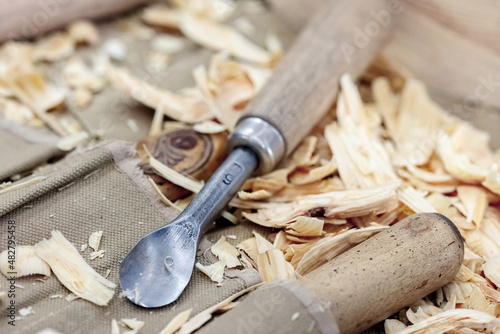 Carpenter tools in wood sawdust on workbench