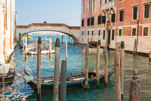 VENICE, ITALY - FEBRAURY 2020: Bridge and boat on canal in Venice.