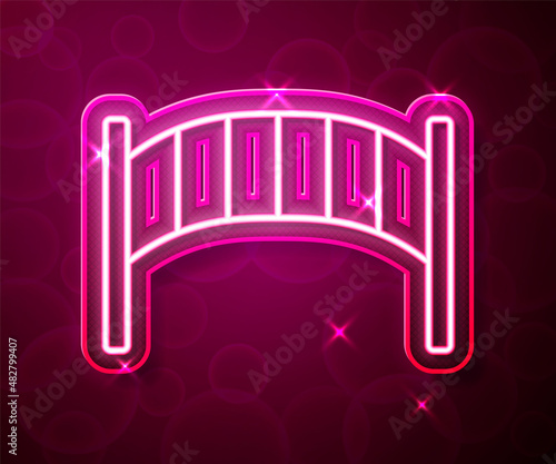 Glowing neon line Playground kids bridge icon isolated on red background. Vector