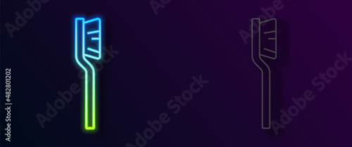 Glowing neon line Toothbrush icon isolated on black background. Vector