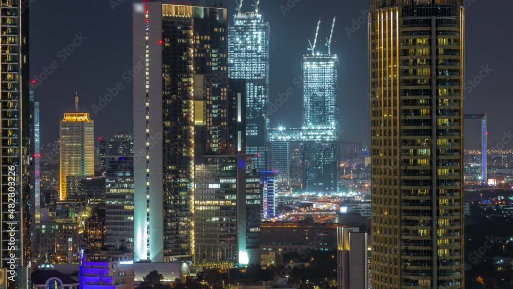 Aerial view of Dubai International Financial Centre district skyscrapers night timelapse Aerial view of Dubai International Financial Centre district skyscrapers night timelapse