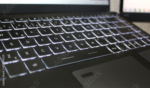 Cool black laptop keyboard with backlit buttons