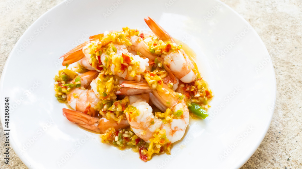 Spicy Shrimp Salad with Garlic chilli fish sauce and lemon in a plate Spicy Shrimp Salad with Garlic chilli fish sauce and lemon in a plate
