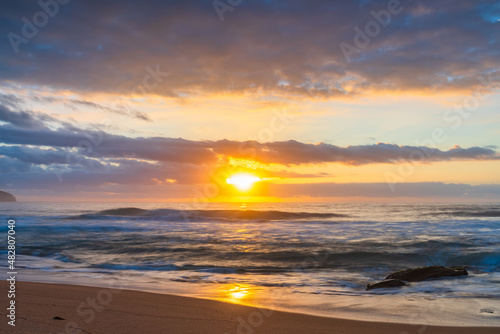 Soft sunrise seascape with clouds