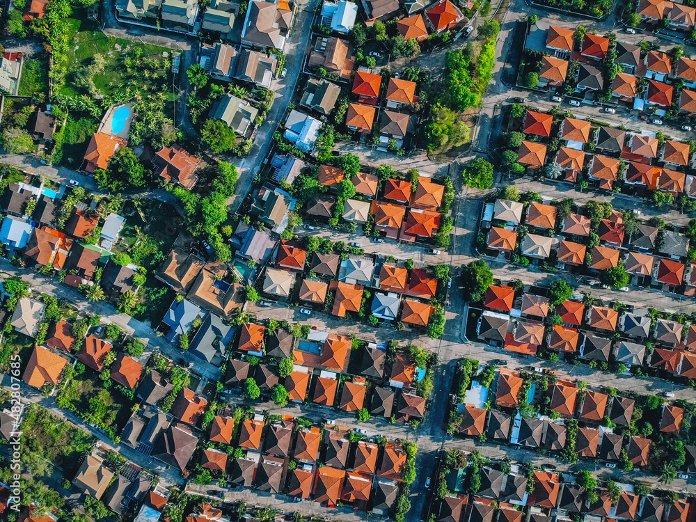 Aerial, bird view of the old european city with red tiled roofs of neighborhood family houses, background