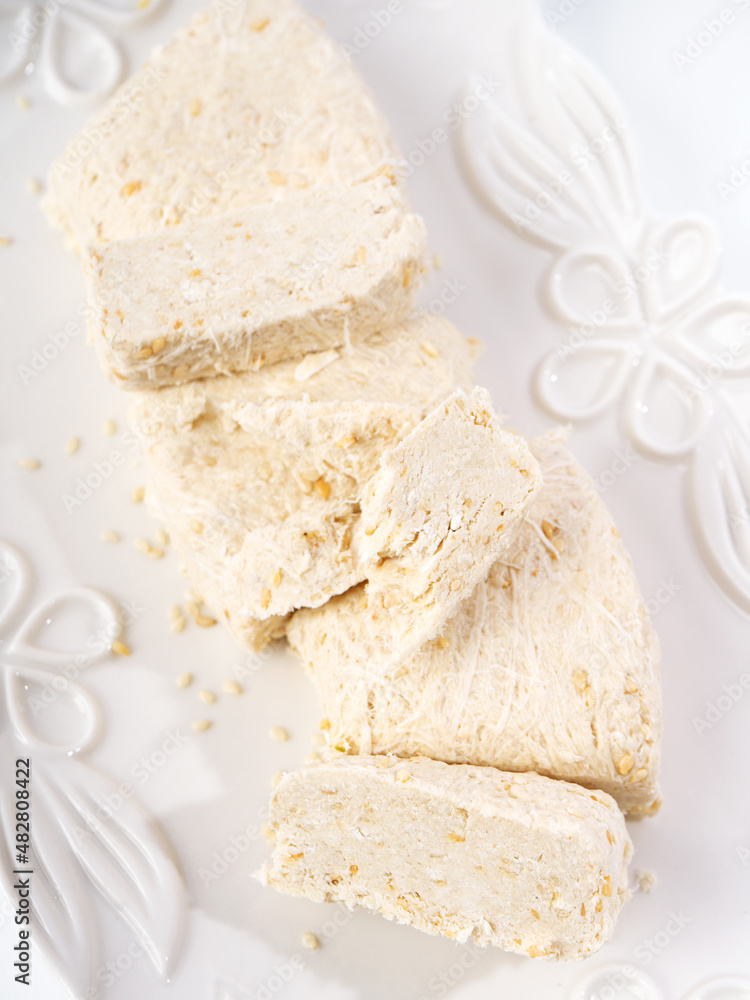 Sesame halva. Top view. Copy space. Traditional middle eastern sweets. Jewish, turkish, arabic national dessert. Turkish delight. Sesame halva. Top view. Copy space. Traditional middle eastern sweets. Jewish, turkish, arabic national dessert. Turkish delight.