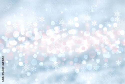 Abstract blurred festive winter christmas or Happy New Year background with shiny blue and white bokeh lighted snow landscape. Space for your design. Card concept.