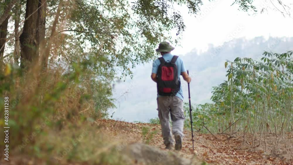 Man hiking in the mountain on vacation summer season, Holiday and outdoor activity concept Man hiking in the mountain on vacation summer season, Holiday and outdoor activity concept