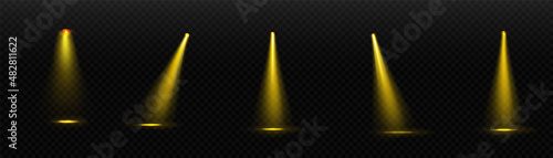 Set of spotlights isolated on transparent background. Vector glowing light effect with yellow rays.
