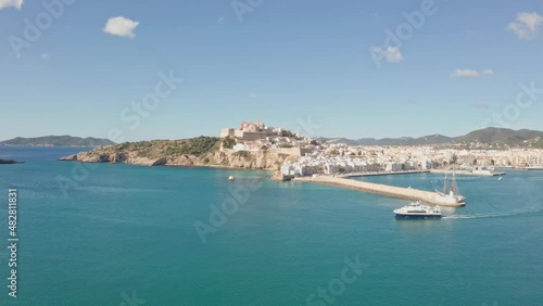 Wallpaper Mural Ibiza, Spain - Boat leaving port of Ibiza City Eivissa. Filmed by drone aerial. Ibiza City in background, ocean in foreground Torontodigital.ca