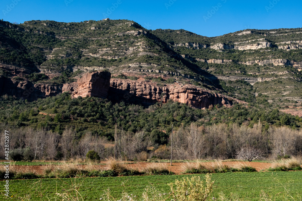 landscape view of catalan mountains and meadows in Sant Miquel del Fai in the Catalonia countryside. Rural catalunya and nature