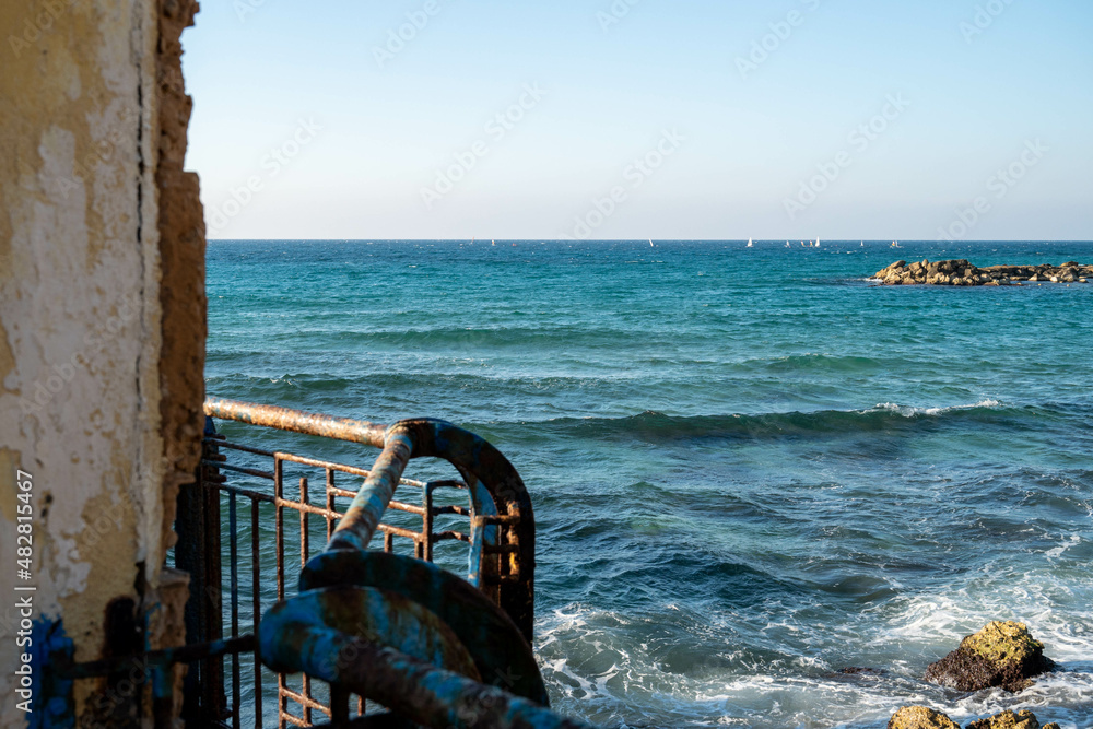 Fototapeta premium Nahariya's Promenade and Galei Galil Beach view of the sea and the shore from the pier