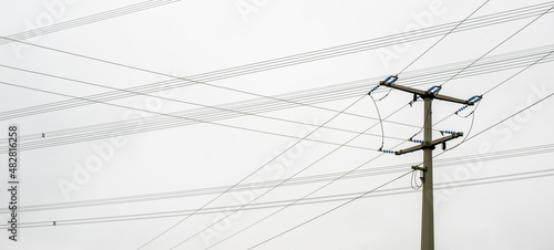 A power pole and overhead lines whose paths cross

An electrical line is an object or system for transporting electrical energy and signal transmission in line-based communications technology. photo