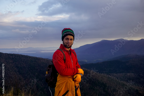 Traveler on top of a mountain at sunset © Pavel