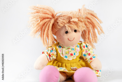 happy kids doll with funny hair and pink shoes