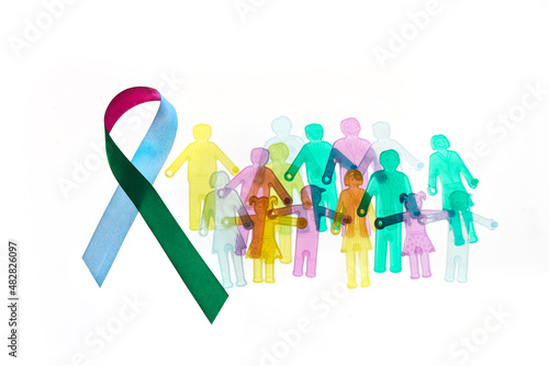 Rare Disease Day Background. Colorful awareness ribbon with group of people with rare diseases. photo