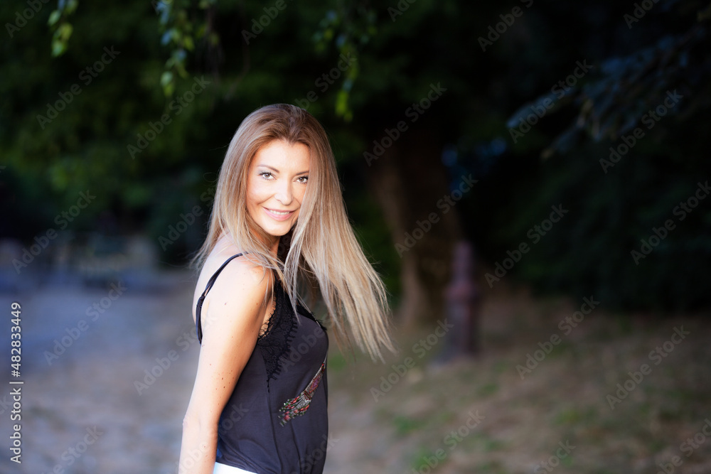 beautiful blond girl iportrait outddoors