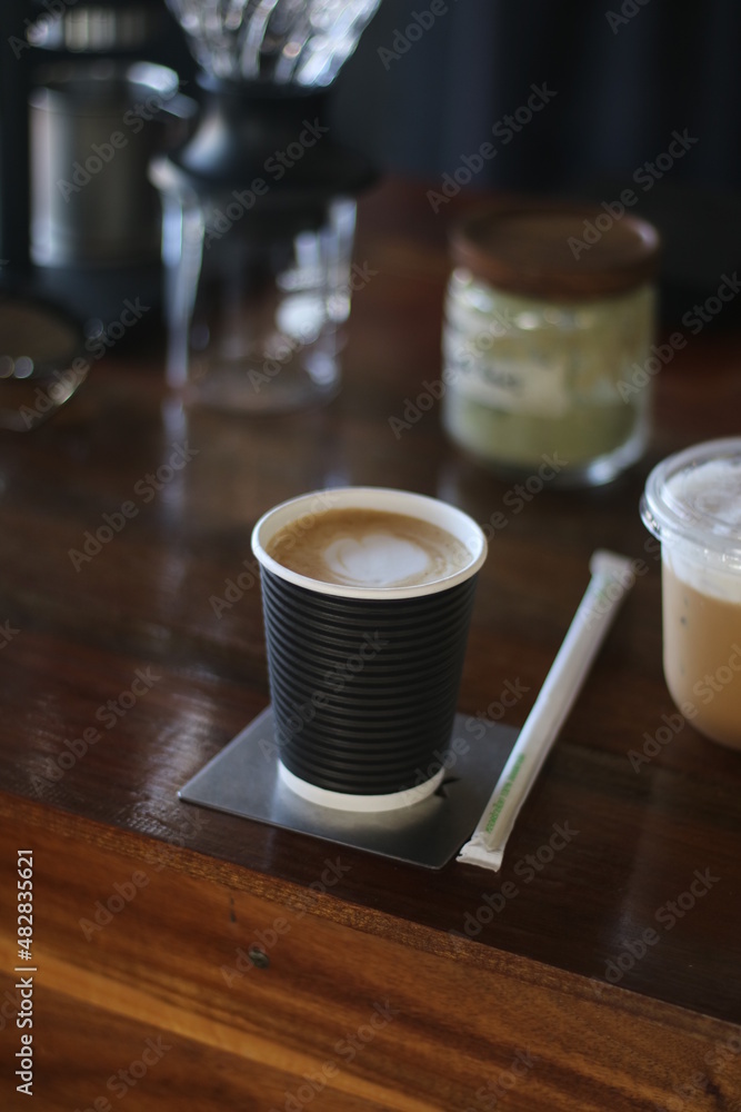 coffee paper cup on the wooden table coffee paper cup on the wooden table