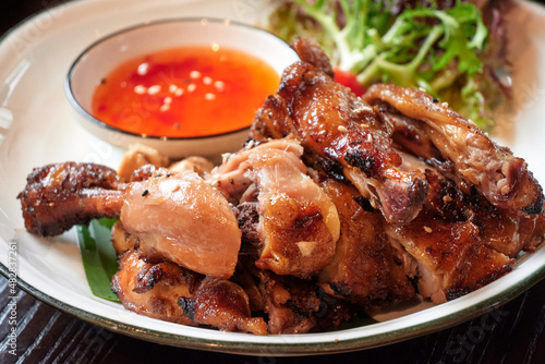 Roasted chicken in Thai style with dip-sauce. photo