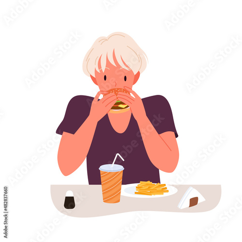 Hungry girl eating burger in fast food restaurant or cafe vector illustration. Cartoon young person with unhealthy diet, female character sitting at table with french fries and drink isolated on white