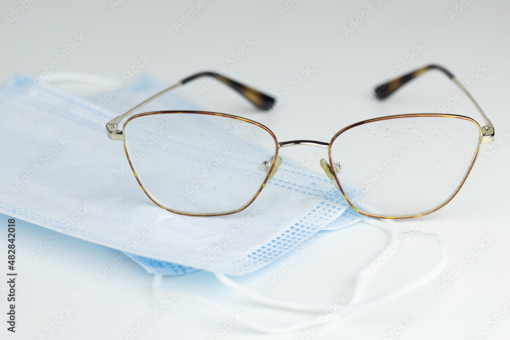 Glasses are being cleaned with anti-fog spray. Glasses are being cleaned with anti-fog spray.
