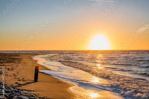 Den Helder  Netherlands. January 2022. Setting sun on the beach of Den Helder  Netherlands.