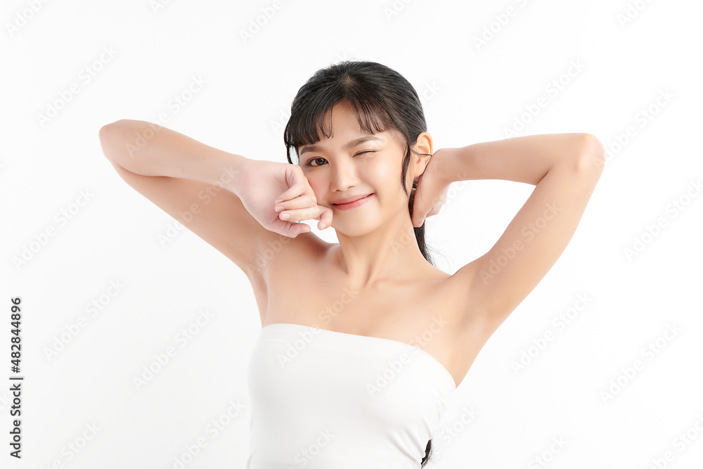 Beautiful Young Asian woman lifting hands up to show off clean and hygienic armpits or underarms on white background, Smooth armpit cleanliness and protection concept Beautiful Young Asian woman lifting hands up to show off clean and hygienic armpits or underarms on white background, Smooth armpit cleanliness and protection concept