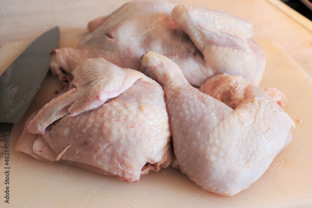 Raw chicken meat thigh, wings, legs and fillet on the kitchen table. Healthy eating. Raw chicken meat thigh, wings, legs and fillet on the kitchen table. Healthy eating.