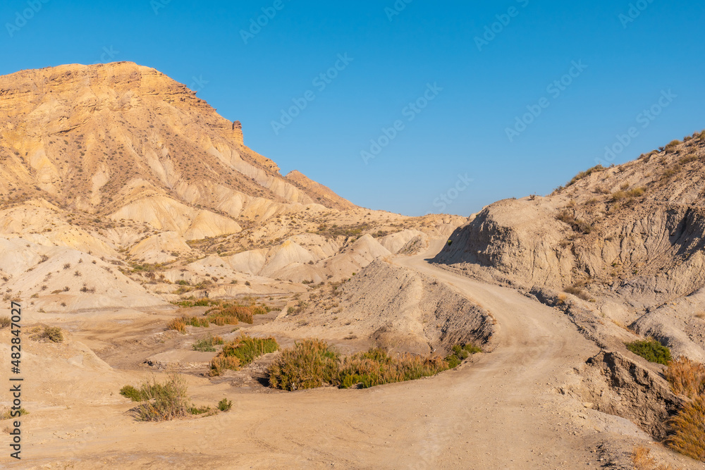 Beautiful trail in the canyon on Rambla de Lanujar in the Tabernas desert, Almería province, Andalusia. Trekking in the desert, lifestyle Beautiful trail in the canyon on Rambla de Lanujar in the Tabernas desert, Almería province, Andalusia. Trekking in the desert, lifestyle