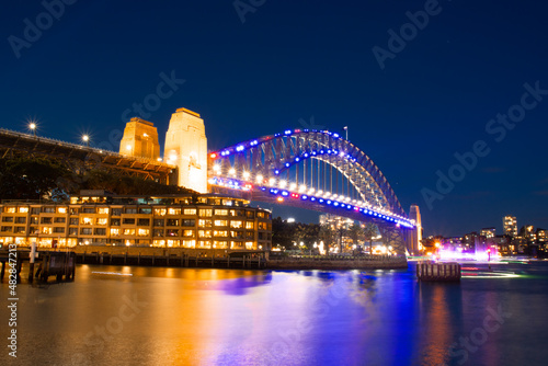 Sydney Harbour Bridge illuminating the night skies viewed from the Rocks on Australia Day   © Elias Bitar
