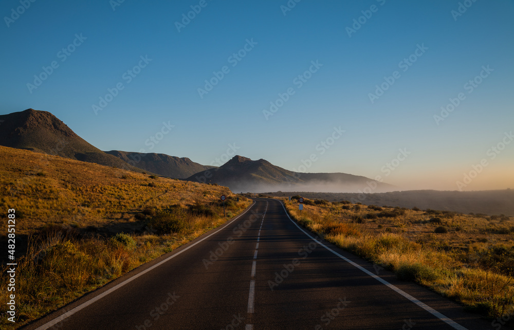 Fototapeta premium Road on Cabo de Gata Nature Park, Almeria, Spain, during sunrise