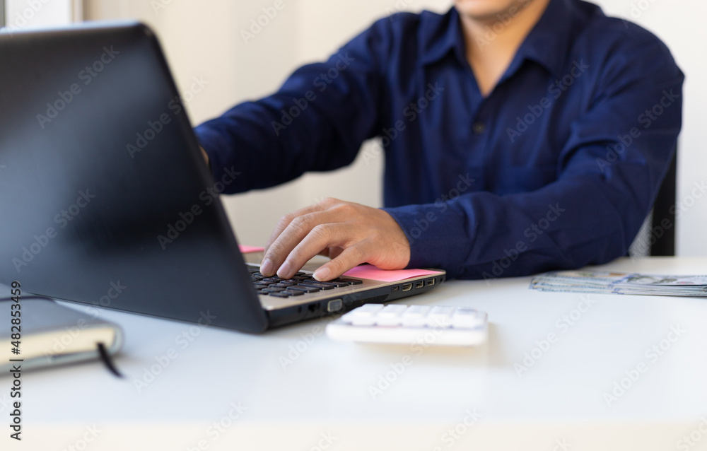 Close-up business man typing while working on laptop. Close-up business man typing while working on laptop.