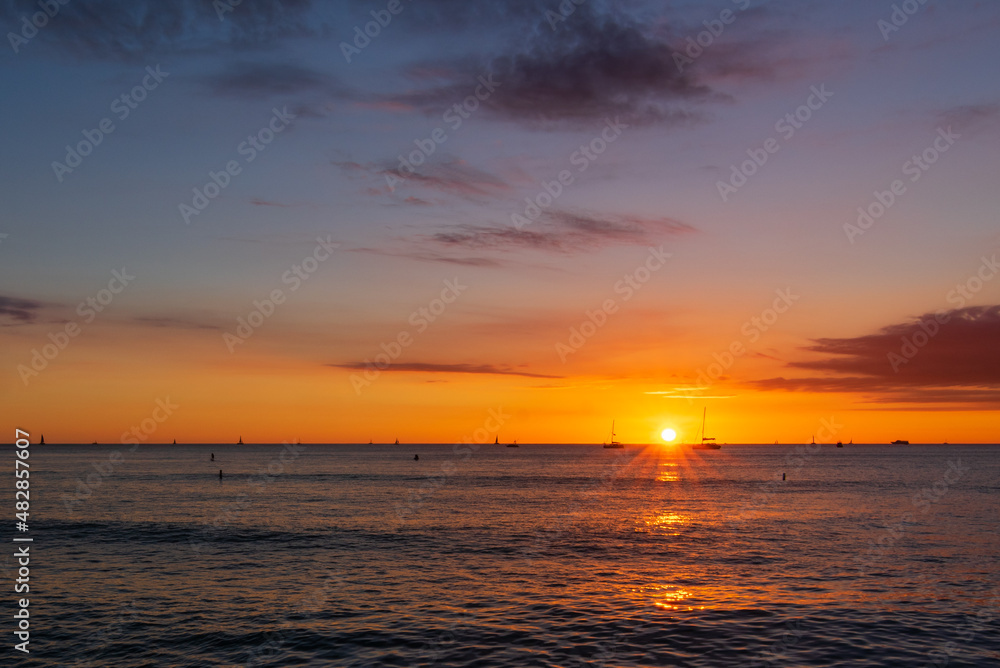 waikiki hawaii sunset over the sea
