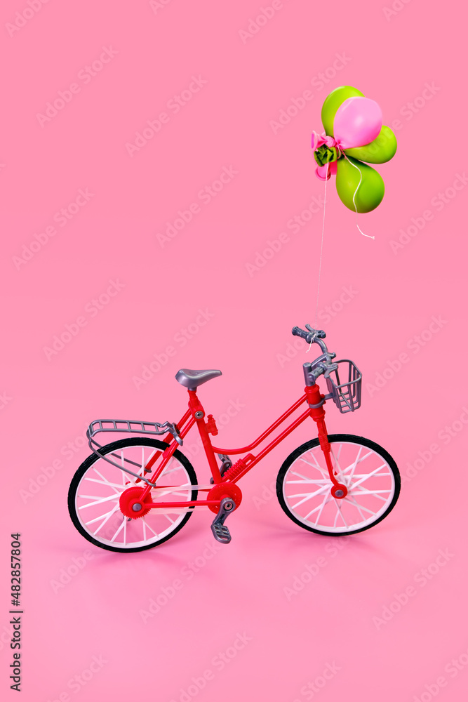 bicycle with several balloons tied to the handlebars bicycle with several balloons tied to the handlebars