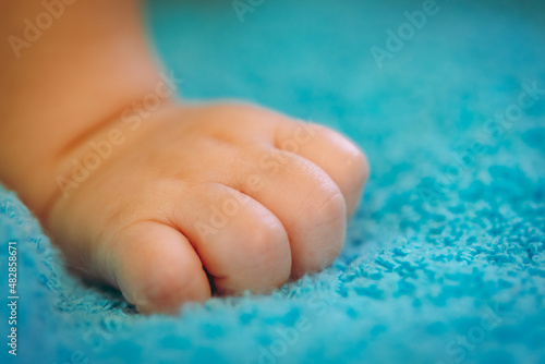 Closeup of newborn baby hand